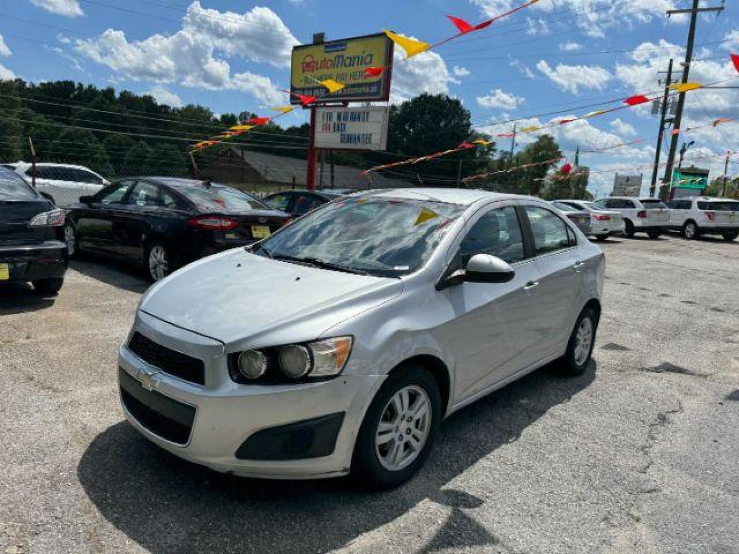 2014 Silver Chevrolet Sonic LT Auto Sedan (1G1JC5SH9E4) with an 1.8L L4 DOHC 24V engine, 6-Speed Automatic transmission, located at 1806 Veterans Memorial Hwy SW, Austell, GA, 30168, (770) 944-9558, 33.817959, -84.606987 - Photo#0