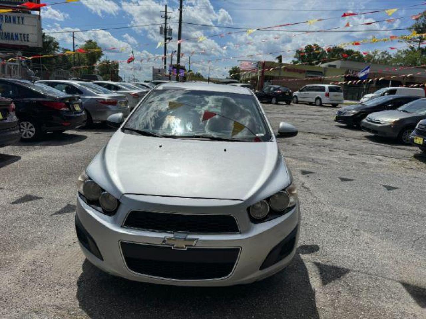 2014 Silver Chevrolet Sonic LT Auto Sedan (1G1JC5SH9E4) with an 1.8L L4 DOHC 24V engine, 6-Speed Automatic transmission, located at 1806 Veterans Memorial Hwy SW, Austell, GA, 30168, (770) 944-9558, 33.817959, -84.606987 - Photo#1