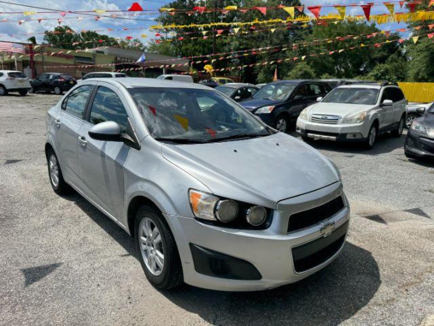 2014 Silver Chevrolet Sonic LT Auto Sedan (1G1JC5SH9E4) with an 1.8L L4 DOHC 24V engine, 6-Speed Automatic transmission, located at 1806 Veterans Memorial Hwy SW, Austell, GA, 30168, (770) 944-9558, 33.817959, -84.606987 - Photo#2