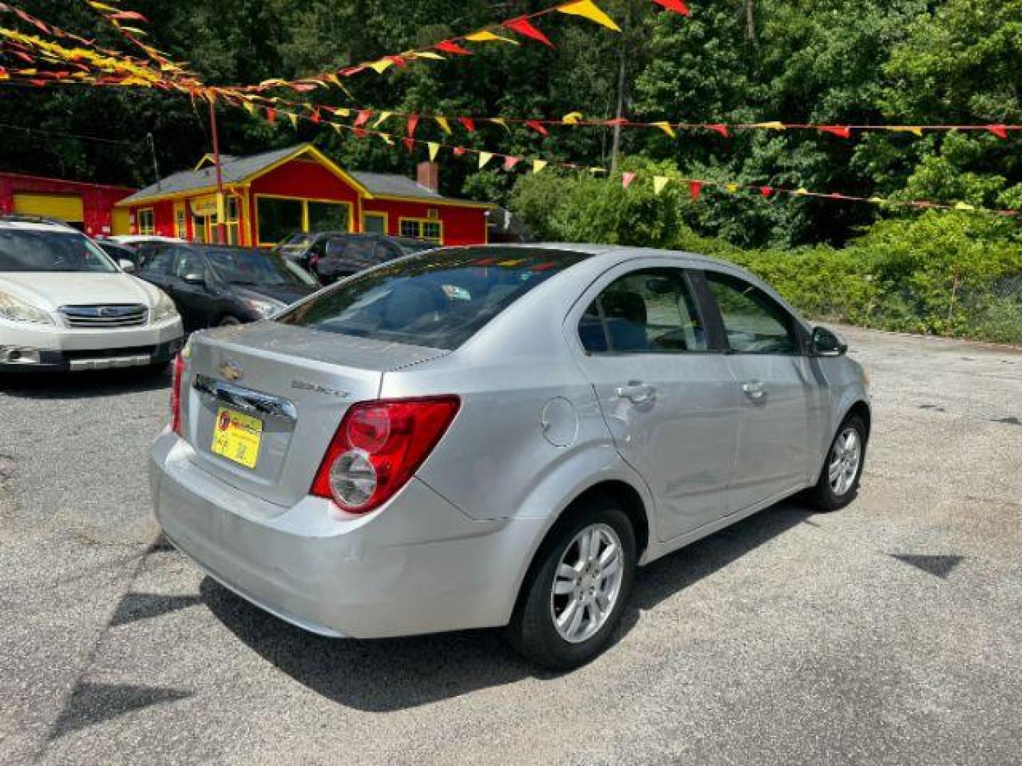 2014 Silver Chevrolet Sonic LT Auto Sedan (1G1JC5SH9E4) with an 1.8L L4 DOHC 24V engine, 6-Speed Automatic transmission, located at 1806 Veterans Memorial Hwy SW, Austell, GA, 30168, (770) 944-9558, 33.817959, -84.606987 - Photo#3