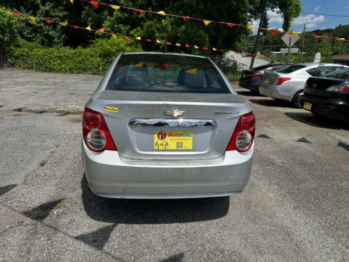 2014 Silver Chevrolet Sonic LT Auto Sedan (1G1JC5SH9E4) with an 1.8L L4 DOHC 24V engine, 6-Speed Automatic transmission, located at 1806 Veterans Memorial Hwy SW, Austell, GA, 30168, (770) 944-9558, 33.817959, -84.606987 - Photo#4