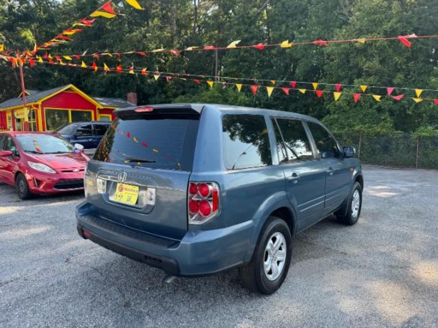 2006 Honda Pilot LX (5FNYF28106B) with an 3.5L V6 SOHC 24V engine, 5-Speed Automatic transmission, located at 1806 Veterans Memorial Hwy SW, Austell, GA, 30168, (770) 944-9558, 33.817959, -84.606987 - Photo#3