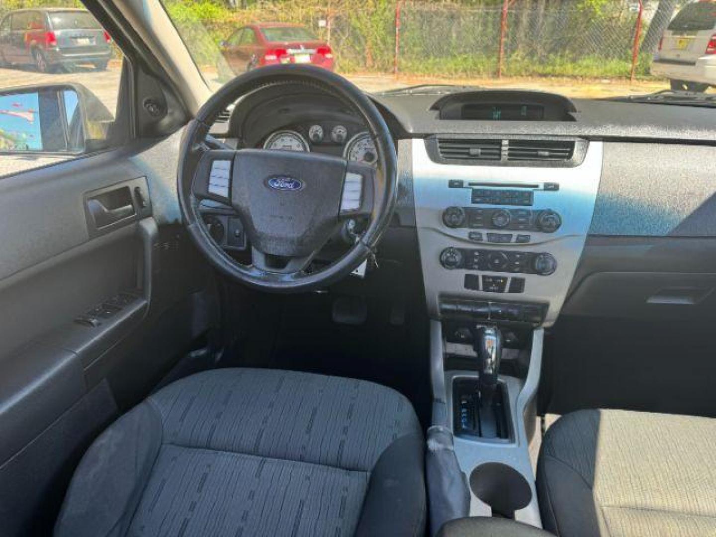 2009 Gray Ford Focus SE Sedan (1FAHP35N19W) with an 2.0L L4 DOHC 16V engine, located at 1806 Veterans Memorial Hwy SW, Austell, GA, 30168, (770) 944-9558, 33.817959, -84.606987 - Photo#12