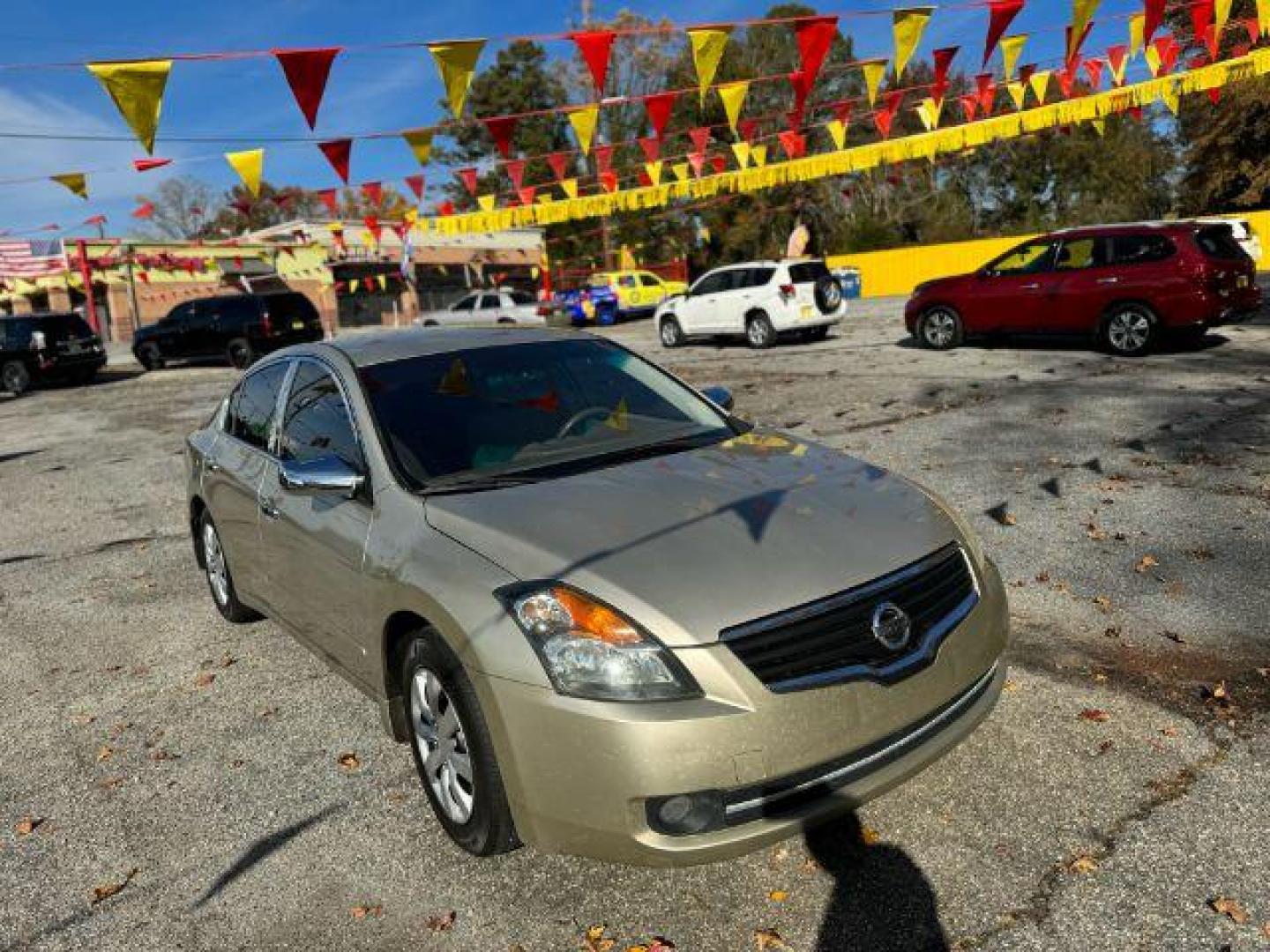 2009 GOLD Nissan Altima 2.5 S (1N4AL21EX9N) with an 2.5L L4 DOHC 16V engine, Continuously Variable Transmission transmission, located at 1806 Veterans Memorial Hwy SW, Austell, GA, 30168, (770) 944-9558, 33.817959, -84.606987 - Photo#1