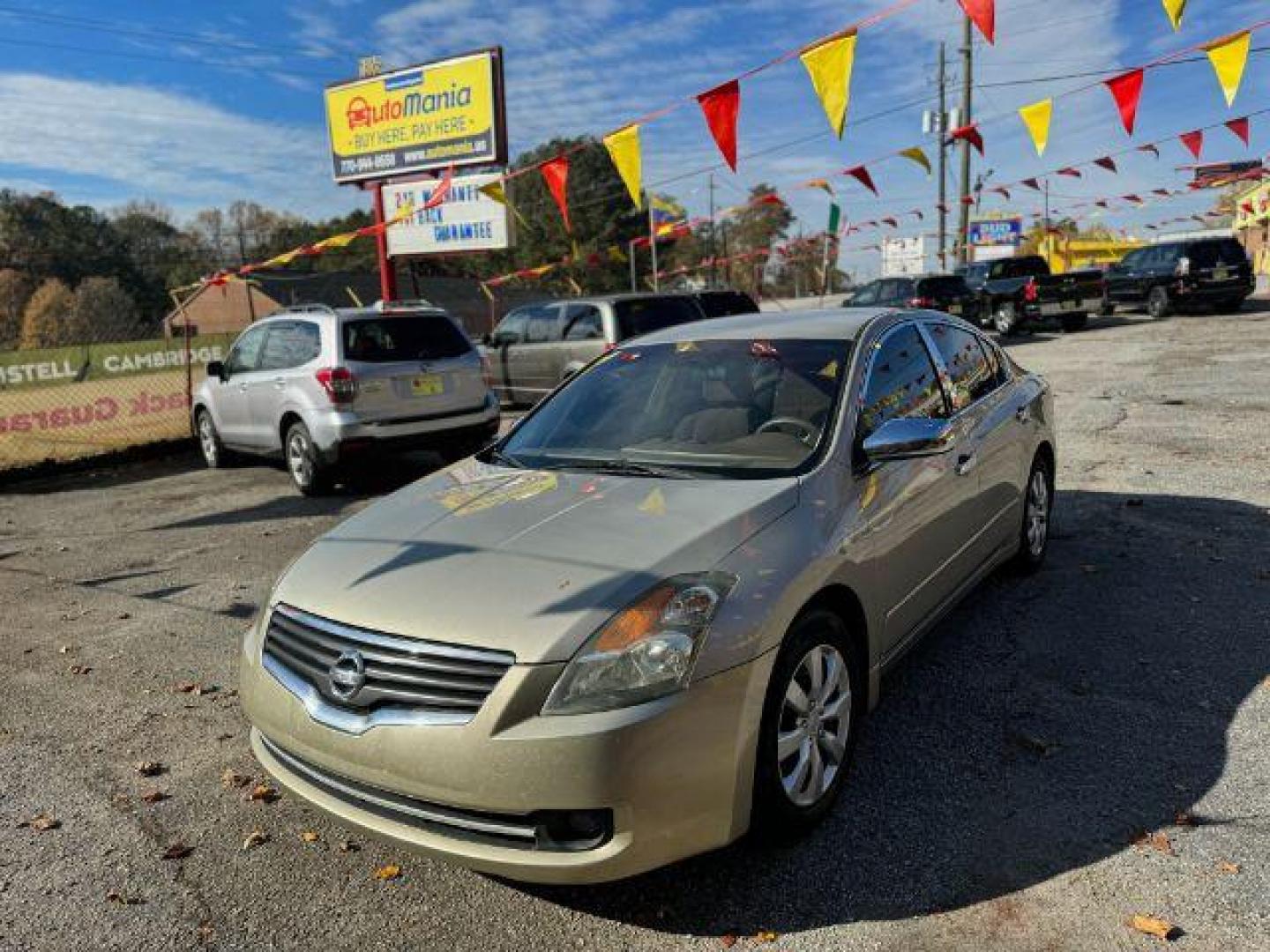 2009 GOLD Nissan Altima 2.5 S (1N4AL21EX9N) with an 2.5L L4 DOHC 16V engine, Continuously Variable Transmission transmission, located at 1806 Veterans Memorial Hwy SW, Austell, GA, 30168, (770) 944-9558, 33.817959, -84.606987 - Photo#2