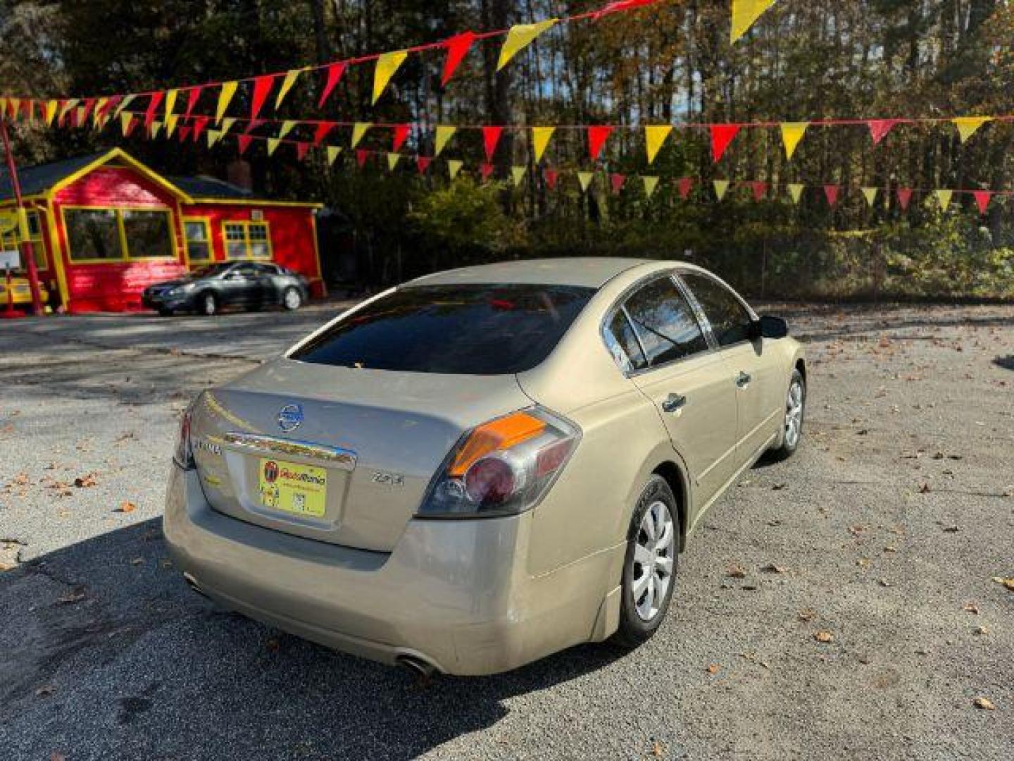 2009 GOLD Nissan Altima 2.5 S (1N4AL21EX9N) with an 2.5L L4 DOHC 16V engine, Continuously Variable Transmission transmission, located at 1806 Veterans Memorial Hwy SW, Austell, GA, 30168, (770) 944-9558, 33.817959, -84.606987 - Photo#3