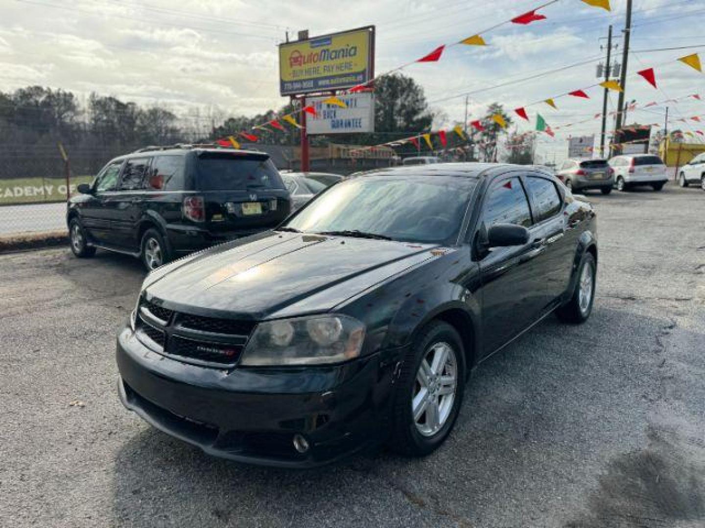 2013 Black Dodge Avenger SXT (1C3CDZCB0DN) with an 2.4L L4 DOHC 16V engine, 6-Speed Automatic transmission, located at 1806 Veterans Memorial Hwy SW, Austell, GA, 30168, (770) 944-9558, 33.817959, -84.606987 - Photo#0