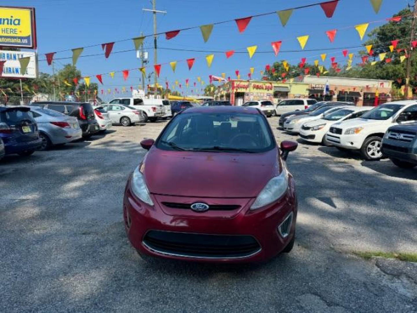 2011 RED Ford Fiesta SE Hatchback (3FADP4EJ6BM) with an 1.6L L4 DOHC 16V engine, 6-Speed Automatic transmission, located at 1806 Veterans Memorial Hwy SW, Austell, GA, 30168, (770) 944-9558, 33.817959, -84.606987 - Photo#1