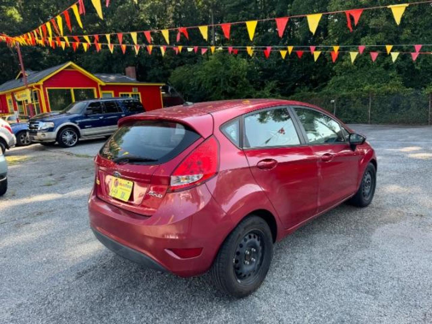 2011 RED Ford Fiesta SE Hatchback (3FADP4EJ6BM) with an 1.6L L4 DOHC 16V engine, 6-Speed Automatic transmission, located at 1806 Veterans Memorial Hwy SW, Austell, GA, 30168, (770) 944-9558, 33.817959, -84.606987 - Photo#3