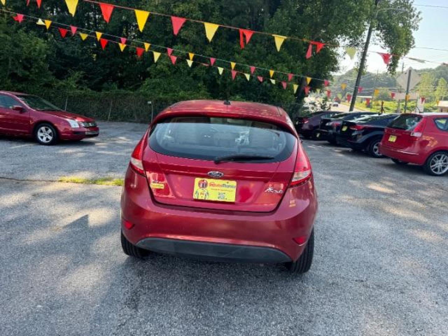 2011 RED Ford Fiesta SE Hatchback (3FADP4EJ6BM) with an 1.6L L4 DOHC 16V engine, 6-Speed Automatic transmission, located at 1806 Veterans Memorial Hwy SW, Austell, GA, 30168, (770) 944-9558, 33.817959, -84.606987 - Photo#4