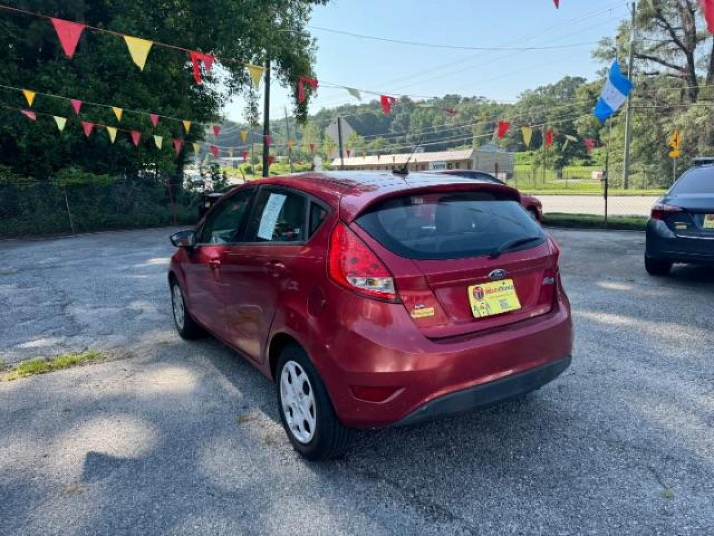 2011 RED Ford Fiesta SE Hatchback (3FADP4EJ6BM) with an 1.6L L4 DOHC 16V engine, 6-Speed Automatic transmission, located at 1806 Veterans Memorial Hwy SW, Austell, GA, 30168, (770) 944-9558, 33.817959, -84.606987 - Photo#5