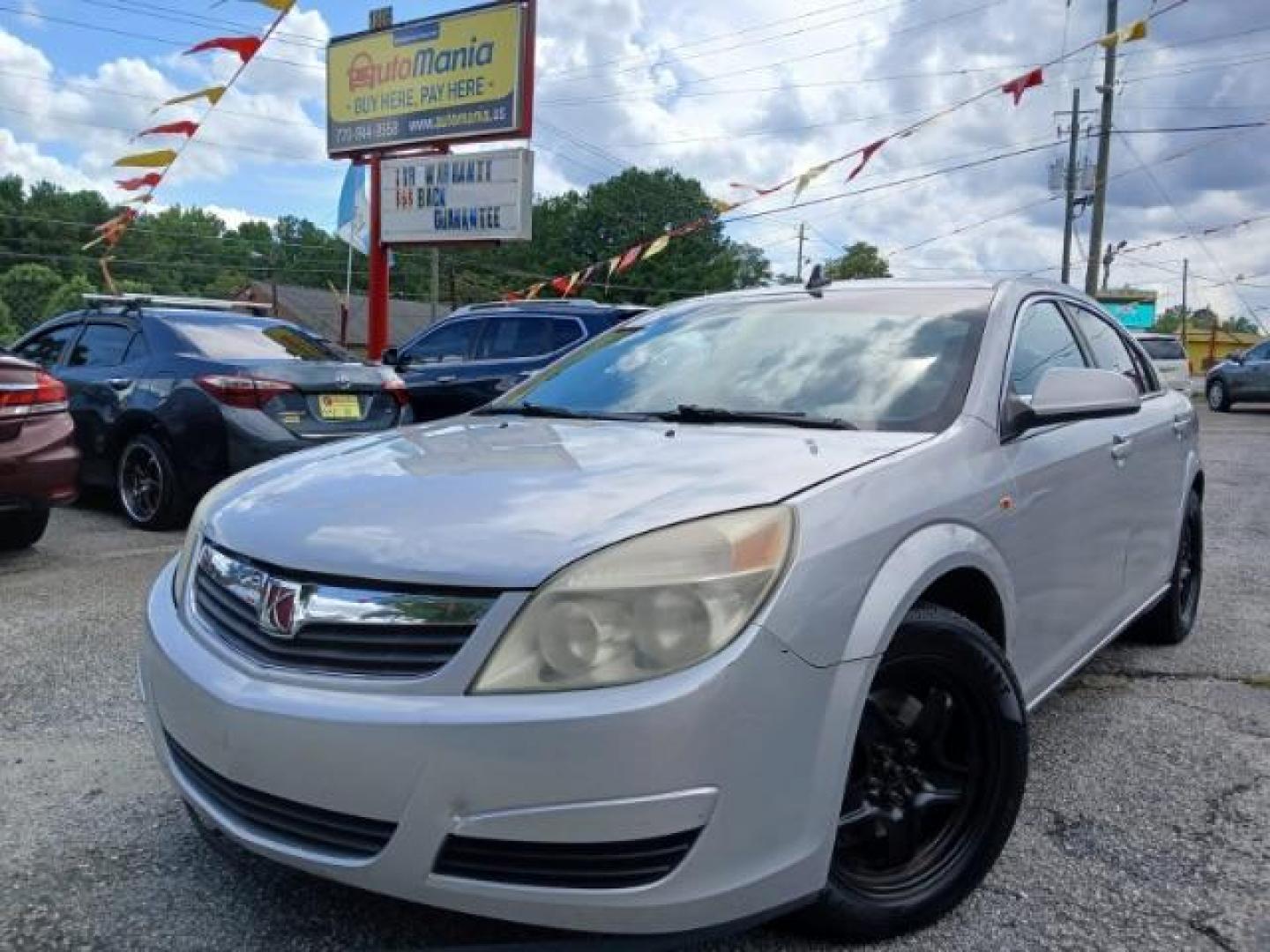 2009 Silver Saturn Aura XE (1G8ZS57B29F) with an 2.4L L4 DOHC 16V engine, 4-Speed Automatic transmission, located at 1806 Veterans Memorial Hwy SW, Austell, GA, 30168, (770) 944-9558, 33.817959, -84.606987 - Photo#1