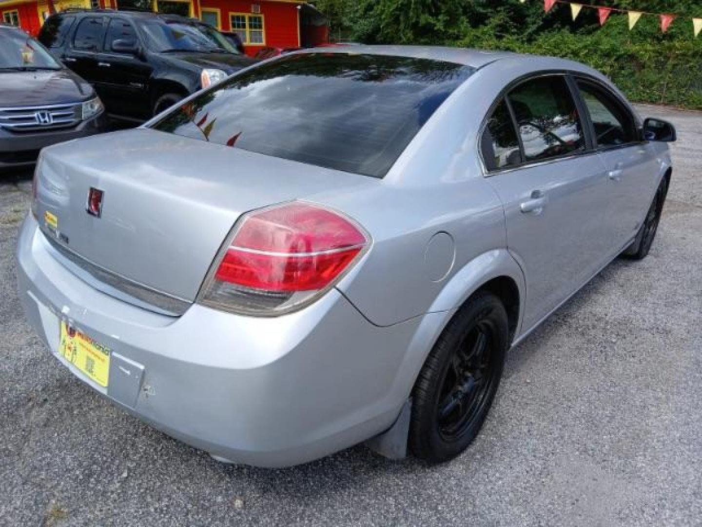 2009 Silver Saturn Aura XE (1G8ZS57B29F) with an 2.4L L4 DOHC 16V engine, 4-Speed Automatic transmission, located at 1806 Veterans Memorial Hwy SW, Austell, GA, 30168, (770) 944-9558, 33.817959, -84.606987 - Photo#2