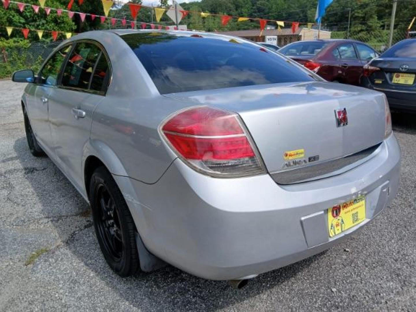 2009 Silver Saturn Aura XE (1G8ZS57B29F) with an 2.4L L4 DOHC 16V engine, 4-Speed Automatic transmission, located at 1806 Veterans Memorial Hwy SW, Austell, GA, 30168, (770) 944-9558, 33.817959, -84.606987 - Photo#3