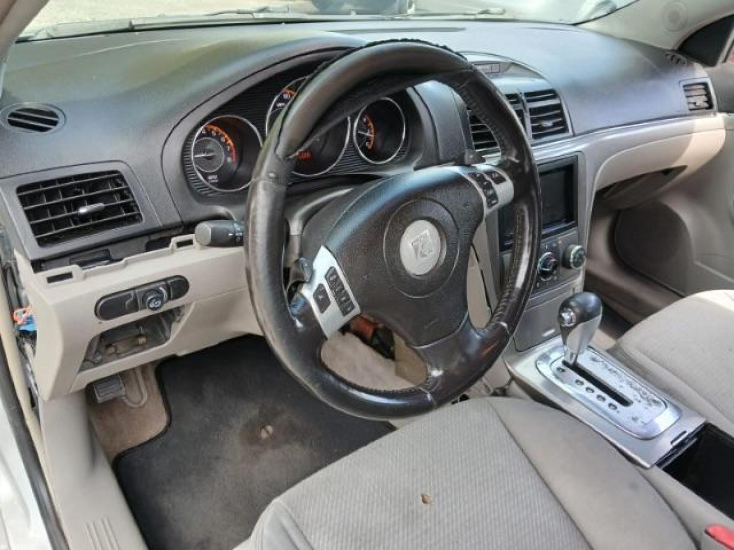 2009 Silver Saturn Aura XE (1G8ZS57B29F) with an 2.4L L4 DOHC 16V engine, 4-Speed Automatic transmission, located at 1806 Veterans Memorial Hwy SW, Austell, GA, 30168, (770) 944-9558, 33.817959, -84.606987 - Photo#5