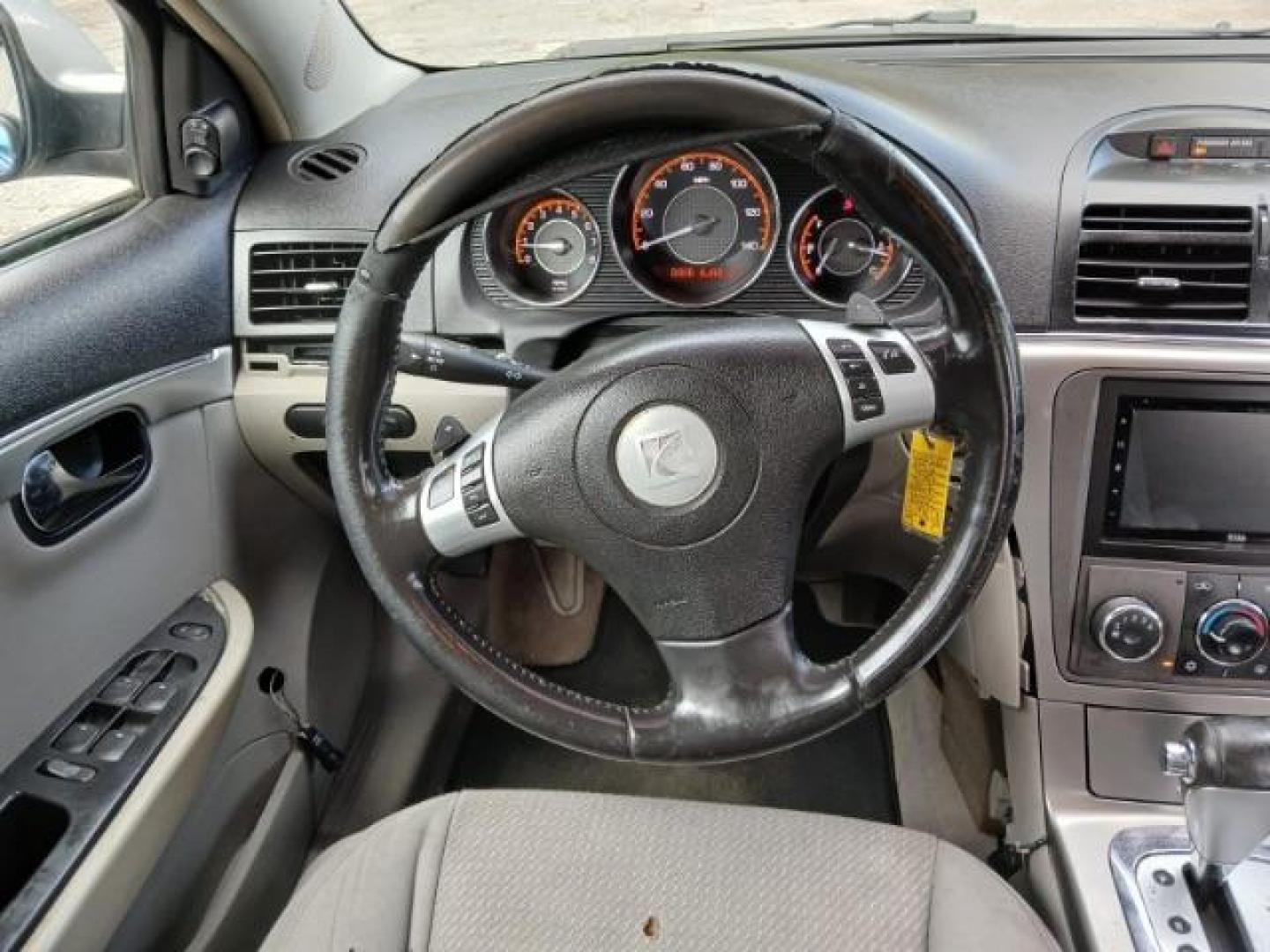 2009 Silver Saturn Aura XE (1G8ZS57B29F) with an 2.4L L4 DOHC 16V engine, 4-Speed Automatic transmission, located at 1806 Veterans Memorial Hwy SW, Austell, GA, 30168, (770) 944-9558, 33.817959, -84.606987 - Photo#6