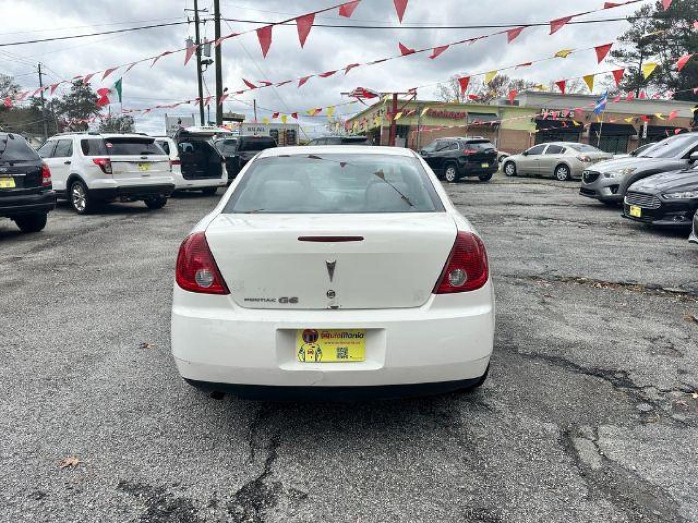 2006 White Pontiac G6 Sedan (1G2ZF55B464) with an 2.4L L4 OHV 8V engine, 4-Speed Automatic transmission, located at 1806 Veterans Memorial Hwy SW, Austell, GA, 30168, (770) 944-9558, 33.817959, -84.606987 - Photo#5