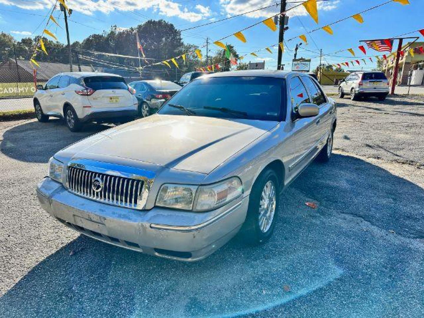 2006 Silver Mercury Grand Marquis LS Premium (2MEFM75V66X) with an 4.6L V8 OHC 16V FFV engine, 4-Speed Automatic transmission, located at 1806 Veterans Memorial Hwy SW, Austell, GA, 30168, (770) 944-9558, 33.817959, -84.606987 - Photo#0