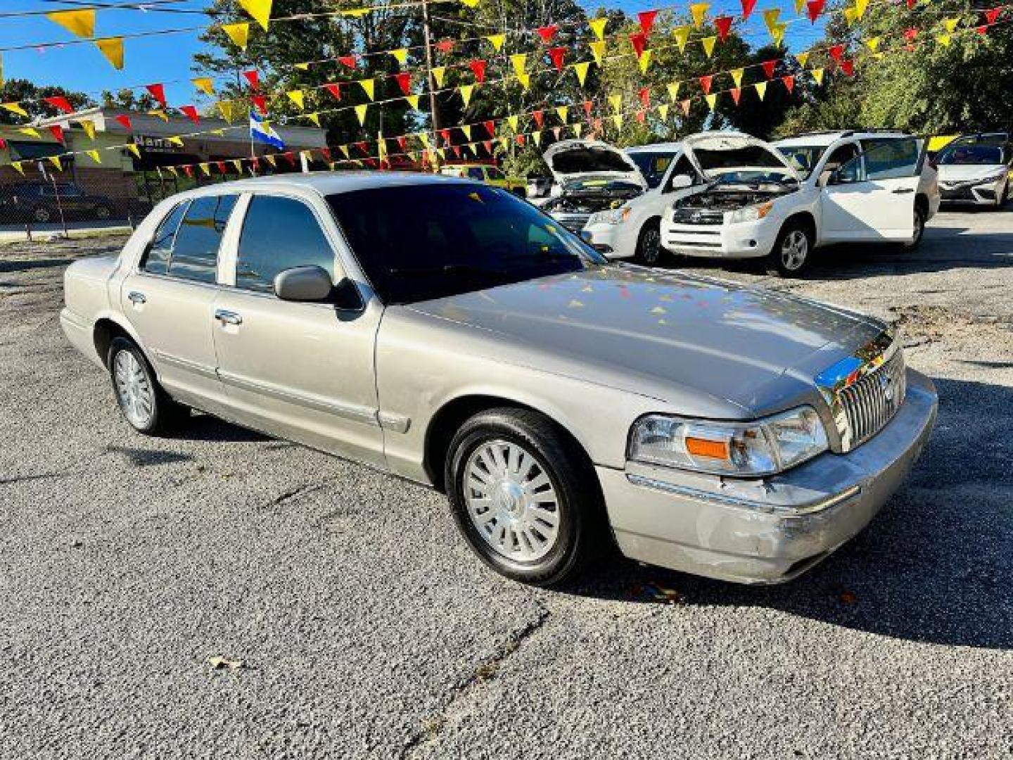 2006 Silver Mercury Grand Marquis LS Premium (2MEFM75V66X) with an 4.6L V8 OHC 16V FFV engine, 4-Speed Automatic transmission, located at 1806 Veterans Memorial Hwy SW, Austell, GA, 30168, (770) 944-9558, 33.817959, -84.606987 - Photo#2