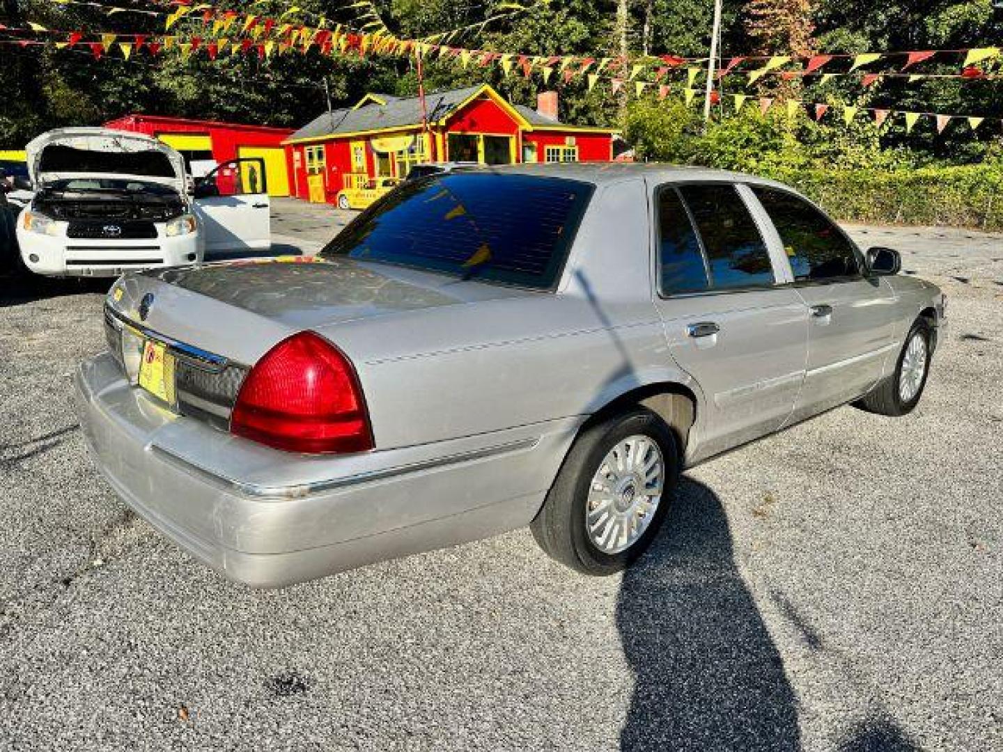 2006 Silver Mercury Grand Marquis LS Premium (2MEFM75V66X) with an 4.6L V8 OHC 16V FFV engine, 4-Speed Automatic transmission, located at 1806 Veterans Memorial Hwy SW, Austell, GA, 30168, (770) 944-9558, 33.817959, -84.606987 - Photo#3