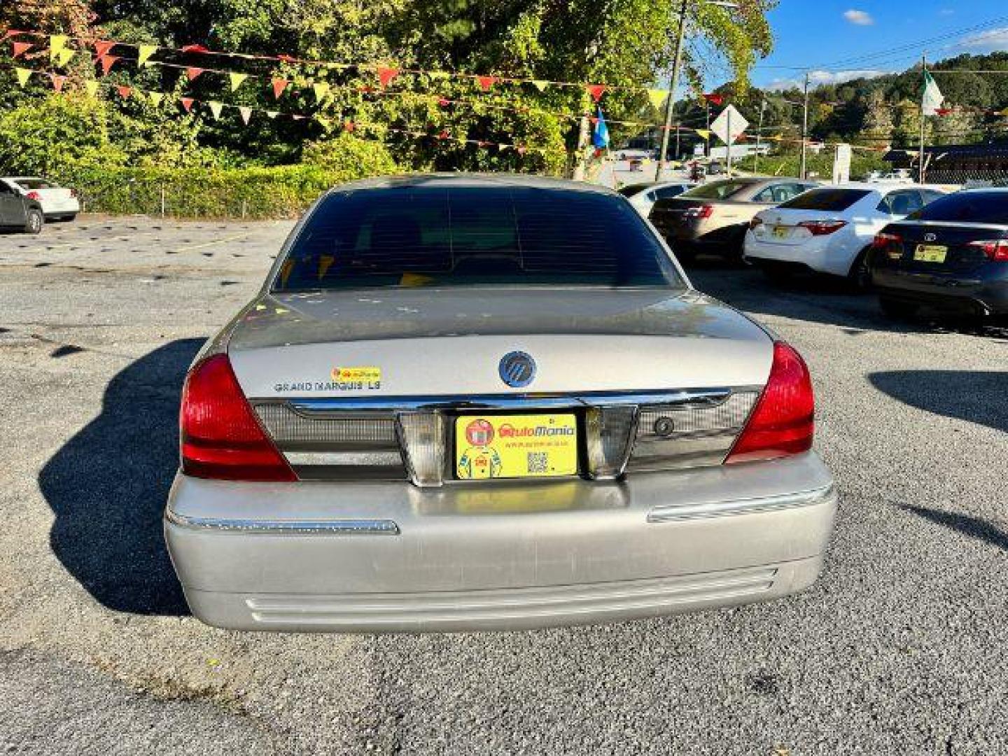 2006 Silver Mercury Grand Marquis LS Premium (2MEFM75V66X) with an 4.6L V8 OHC 16V FFV engine, 4-Speed Automatic transmission, located at 1806 Veterans Memorial Hwy SW, Austell, GA, 30168, (770) 944-9558, 33.817959, -84.606987 - Photo#4