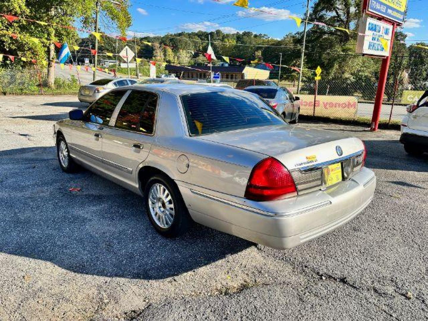 2006 Silver Mercury Grand Marquis LS Premium (2MEFM75V66X) with an 4.6L V8 OHC 16V FFV engine, 4-Speed Automatic transmission, located at 1806 Veterans Memorial Hwy SW, Austell, GA, 30168, (770) 944-9558, 33.817959, -84.606987 - Photo#5