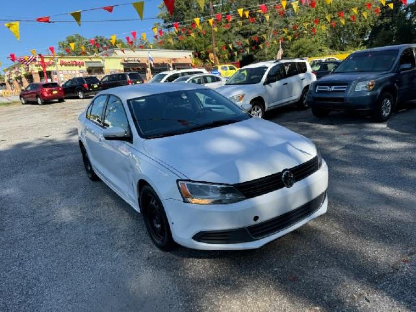 2012 WHITE Volkswagen Jetta SE (3VWDX7AJ9CM) with an 2.5L L5 DOHC 20V engine, 6-Speed Automatic transmission, located at 1806 Veterans Memorial Hwy SW, Austell, GA, 30168, (770) 944-9558, 33.817959, -84.606987 - Photo#2