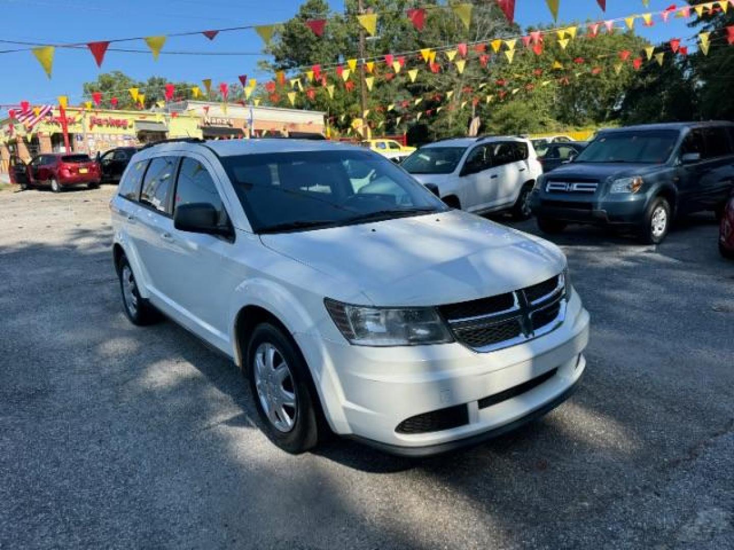 2014 WHITE Dodge Journey SE (3C4PDCAB5ET) with an 2.4L L4 DOHC 16V engine, 4-Speed Automatic transmission, located at 1806 Veterans Memorial Hwy SW, Austell, GA, 30168, (770) 944-9558, 33.817959, -84.606987 - Photo#2