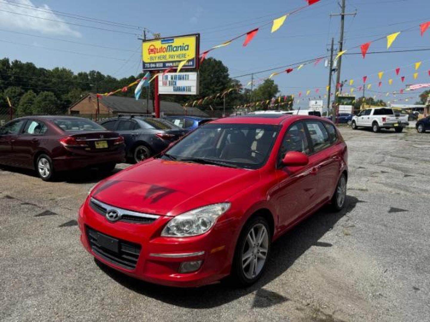 2009 Red Hyundai Elantra Automatic (KMHDC86E09U) with an 2.0L L4 DOHC 16V engine, 4-Speed Automatic transmission, located at 1806 Veterans Memorial Hwy SW, Austell, GA, 30168, (770) 944-9558, 33.817959, -84.606987 - Photo#0