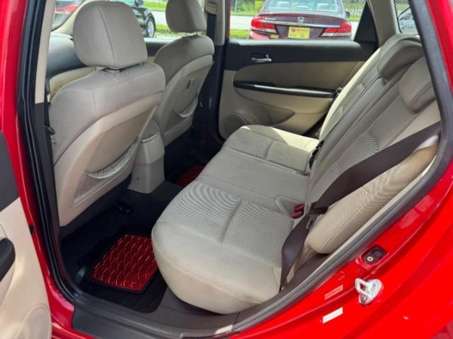 2009 Red Hyundai Elantra Automatic (KMHDC86E09U) with an 2.0L L4 DOHC 16V engine, 4-Speed Automatic transmission, located at 1806 Veterans Memorial Hwy SW, Austell, GA, 30168, (770) 944-9558, 33.817959, -84.606987 - Photo#9