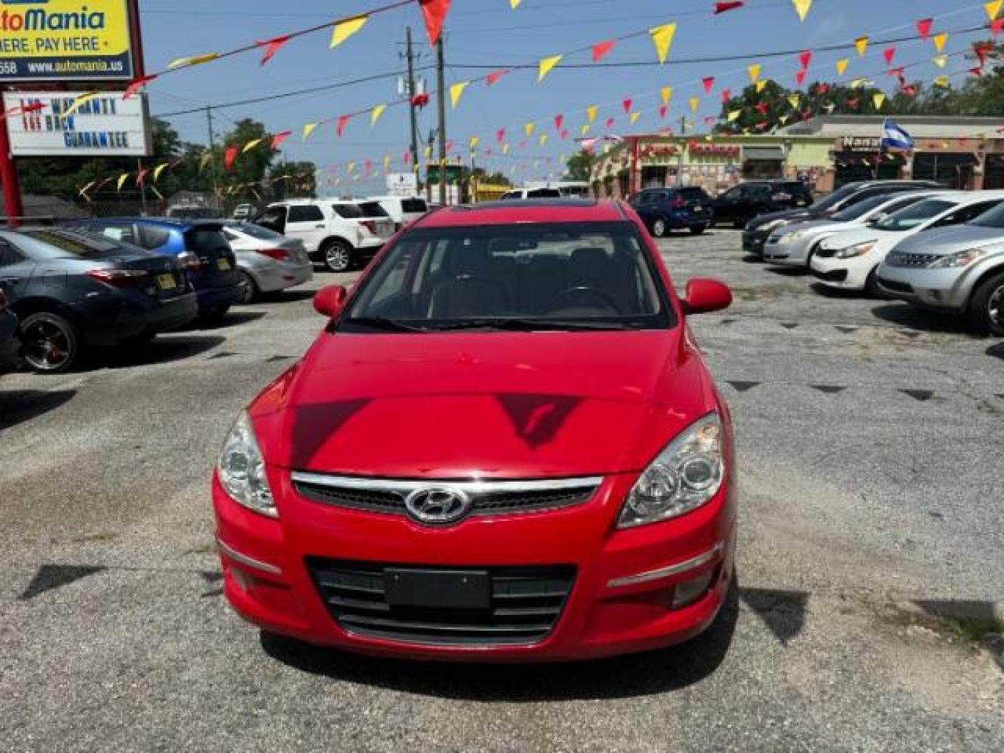 2009 Red Hyundai Elantra Automatic (KMHDC86E09U) with an 2.0L L4 DOHC 16V engine, 4-Speed Automatic transmission, located at 1806 Veterans Memorial Hwy SW, Austell, GA, 30168, (770) 944-9558, 33.817959, -84.606987 - Photo#1