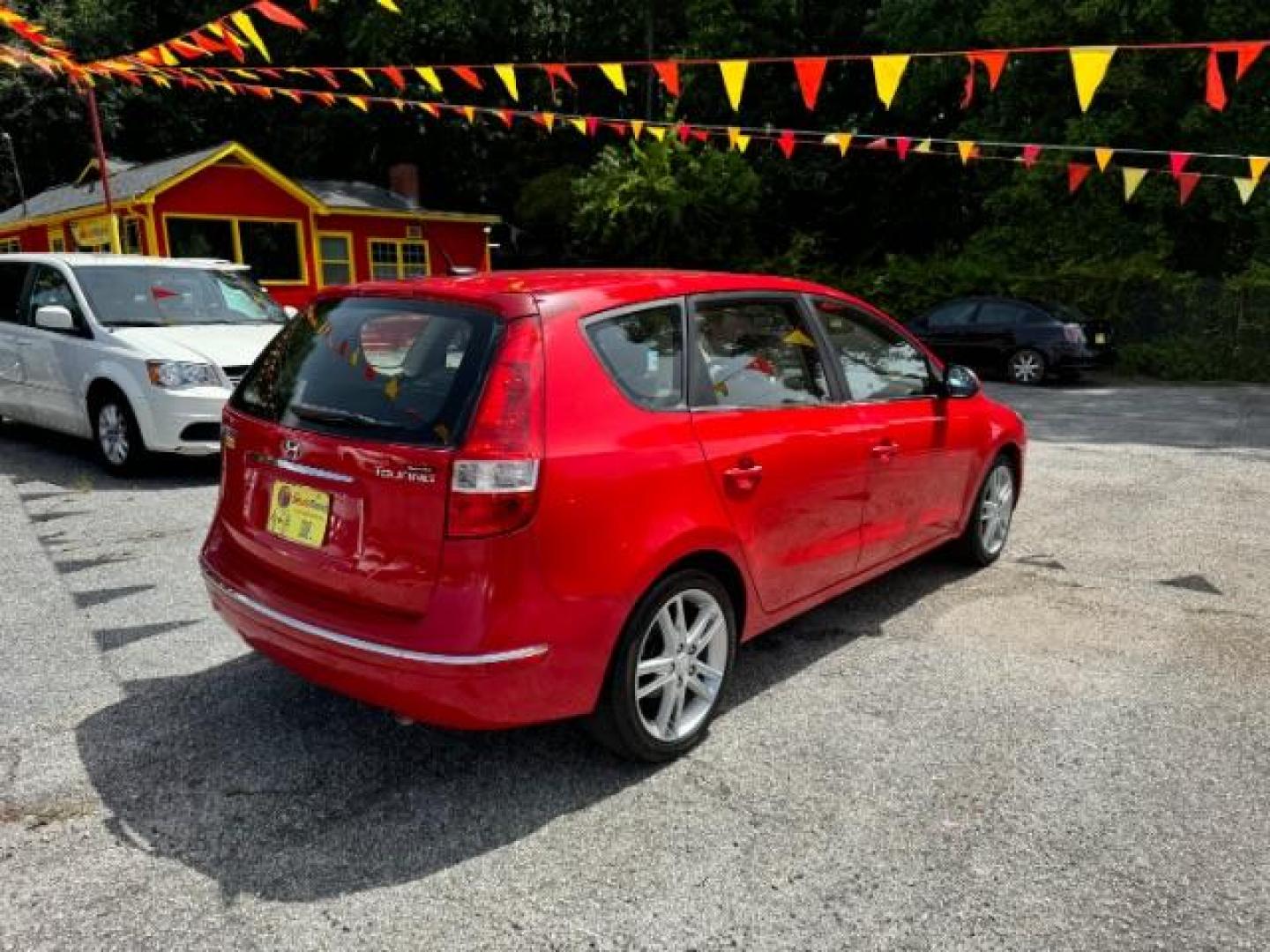 2009 Red Hyundai Elantra Automatic (KMHDC86E09U) with an 2.0L L4 DOHC 16V engine, 4-Speed Automatic transmission, located at 1806 Veterans Memorial Hwy SW, Austell, GA, 30168, (770) 944-9558, 33.817959, -84.606987 - Photo#3