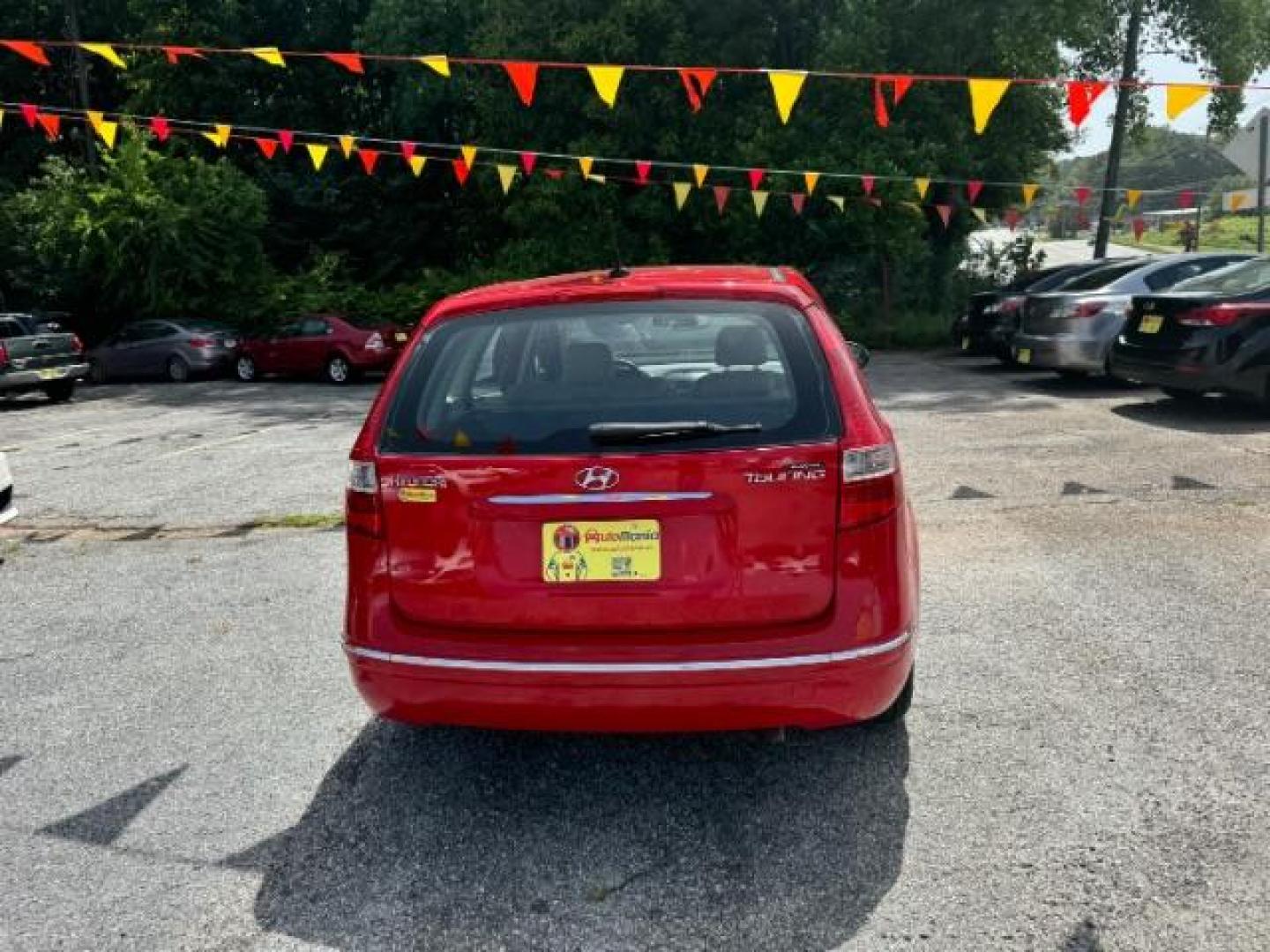 2009 Red Hyundai Elantra Automatic (KMHDC86E09U) with an 2.0L L4 DOHC 16V engine, 4-Speed Automatic transmission, located at 1806 Veterans Memorial Hwy SW, Austell, GA, 30168, (770) 944-9558, 33.817959, -84.606987 - Photo#4