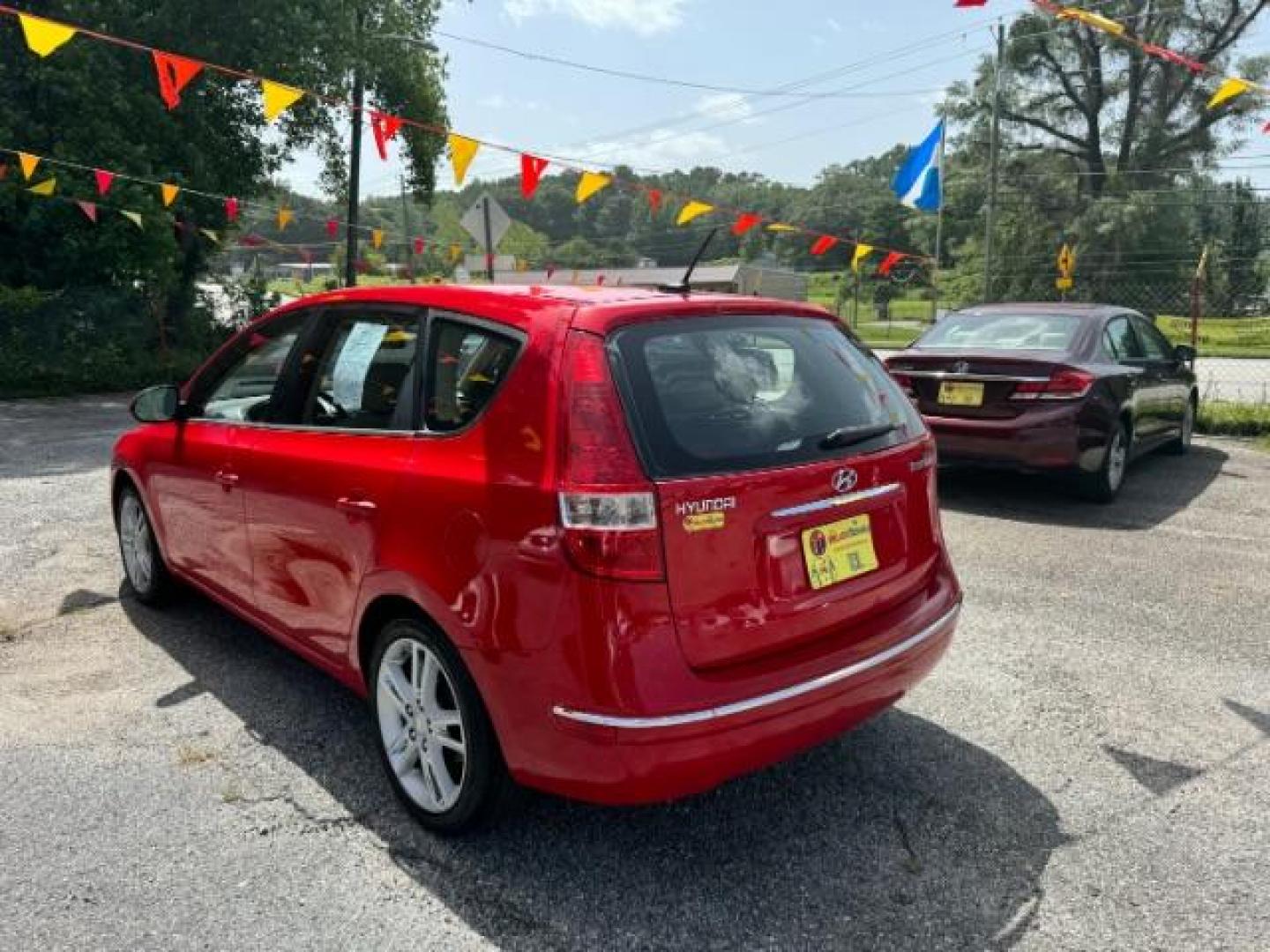 2009 Red Hyundai Elantra Automatic (KMHDC86E09U) with an 2.0L L4 DOHC 16V engine, 4-Speed Automatic transmission, located at 1806 Veterans Memorial Hwy SW, Austell, GA, 30168, (770) 944-9558, 33.817959, -84.606987 - Photo#5