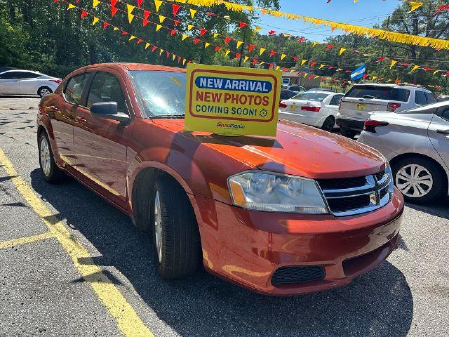 2012 Orange Dodge Avenger Base (1C3CDZABXCN) with an 2.4L L4 DOHC 16V engine, 4-Speed Automatic transmission, located at 1806 Veterans Memorial Hwy SW, Austell, GA, 30168, (770) 944-9558, 33.817959, -84.606987 - Photo#0