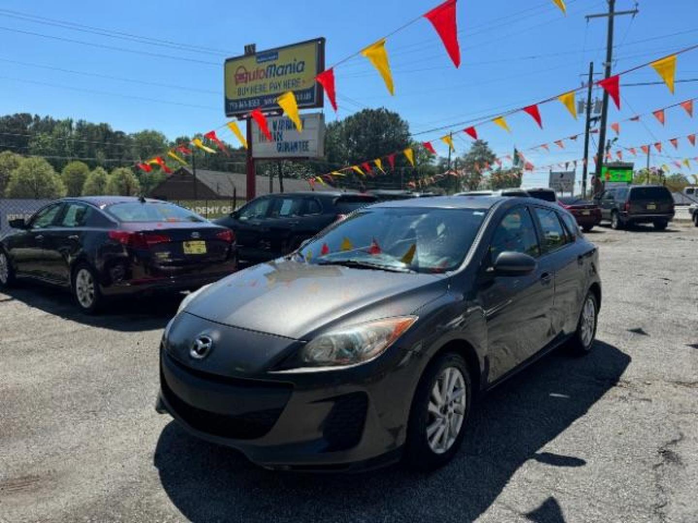 2012 GRAY Mazda MAZDA3 I Touring 5-Door (JM1BL1L83C1) with an 2.0L L4 DOHC 16V engine, 5-Speed Automatic transmission, located at 1806 Veterans Memorial Hwy SW, Austell, GA, 30168, (770) 944-9558, 33.817959, -84.606987 - Photo#0