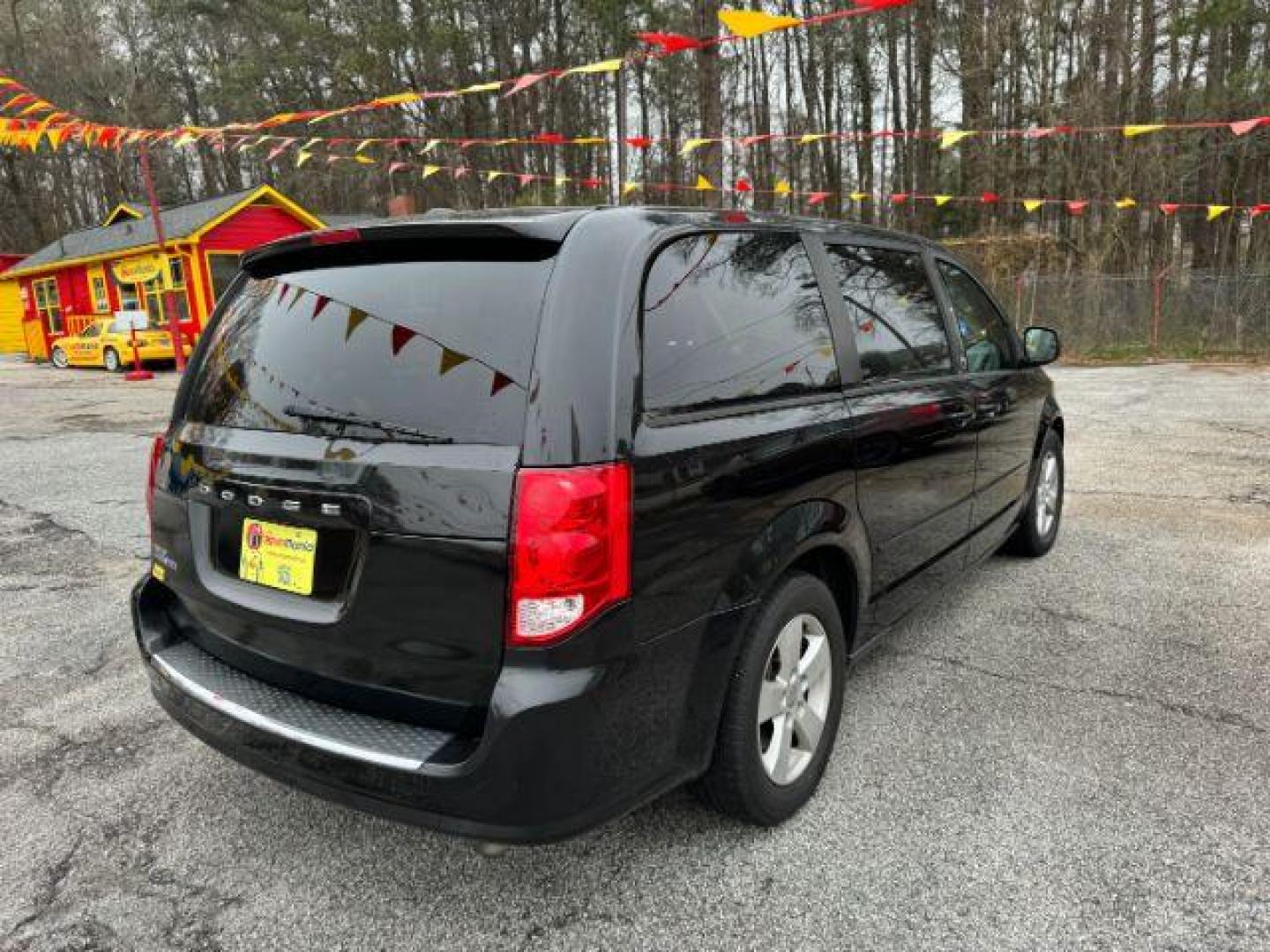 2013 Black Dodge Grand Caravan SE (2C4RDGBG3DR) with an 3.6L V6 DOHC 24V engine, 6-Speed Automatic transmission, located at 1806 Veterans Memorial Hwy SW, Austell, GA, 30168, (770) 944-9558, 33.817959, -84.606987 - Photo#3