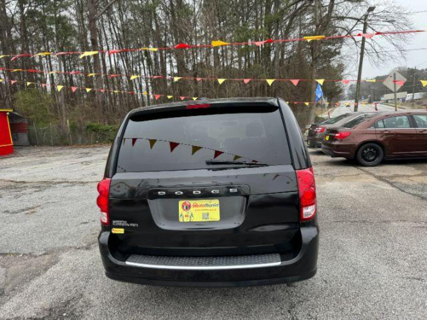 2013 Black Dodge Grand Caravan SE (2C4RDGBG3DR) with an 3.6L V6 DOHC 24V engine, 6-Speed Automatic transmission, located at 1806 Veterans Memorial Hwy SW, Austell, GA, 30168, (770) 944-9558, 33.817959, -84.606987 - Photo#5