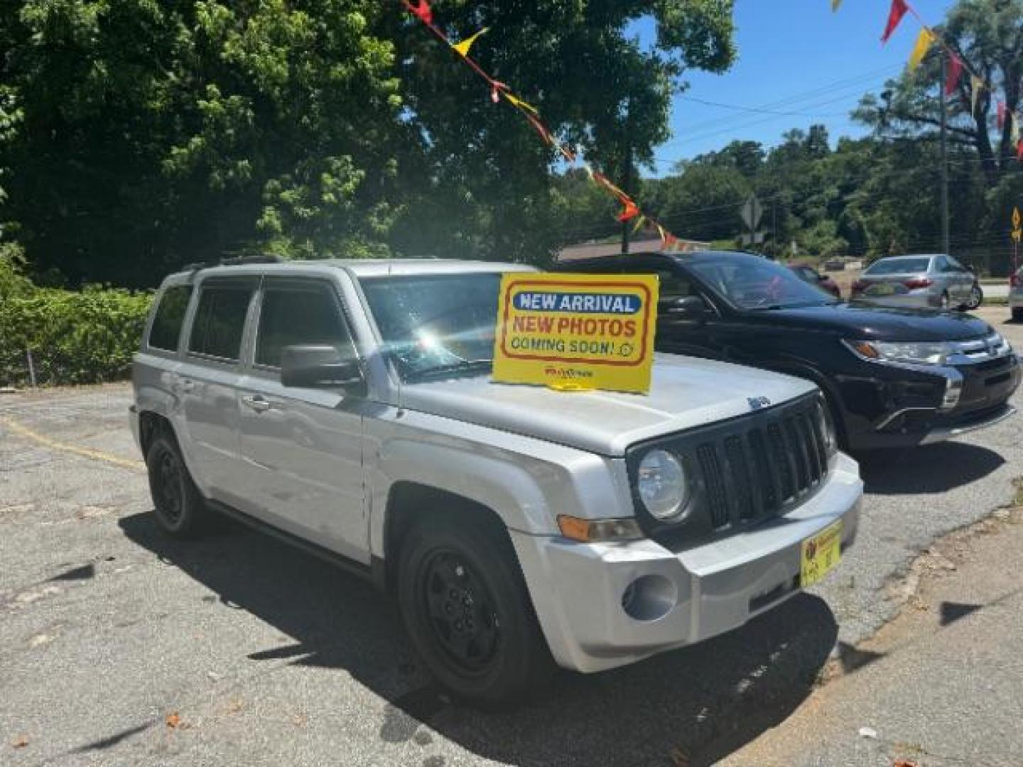 2010 Silver Jeep Patriot Sport 2WD (1J4NT2GB2AD) with an 2.4L L4 DOHC 16V engine, Continuously Variabl transmission, located at 1806 Veterans Memorial Hwy SW, Austell, GA, 30168, (770) 944-9558, 33.817959, -84.606987 - Photo#0