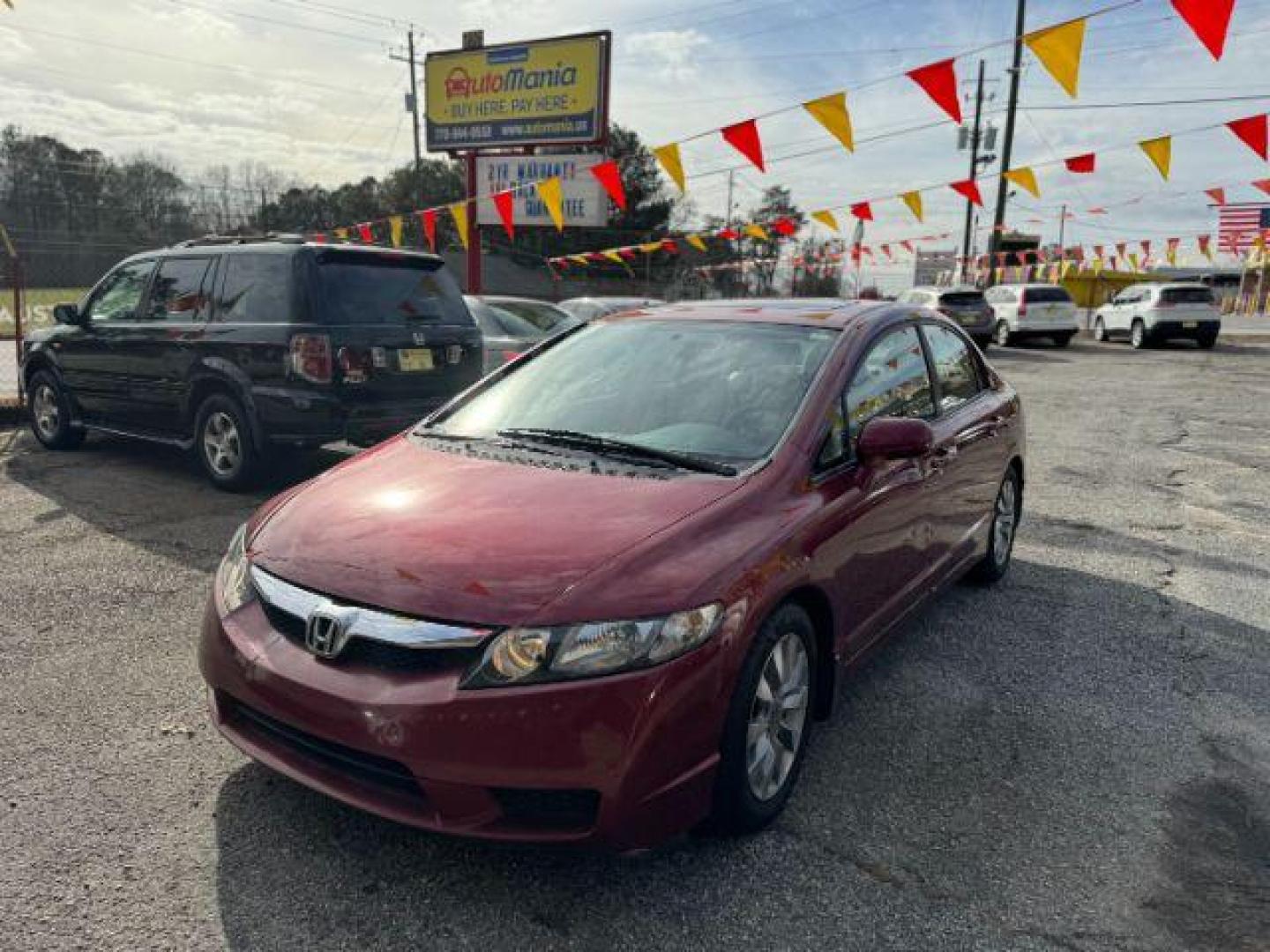 2010 Maroon Honda Civic EX-L Sedan 5-Speed A (19XFA1F92AE) with an 1.8L L4 SOHC 16V engine, 5-Speed Automatic transmission, located at 1806 Veterans Memorial Hwy SW, Austell, GA, 30168, (770) 944-9558, 33.817959, -84.606987 - Photo#0