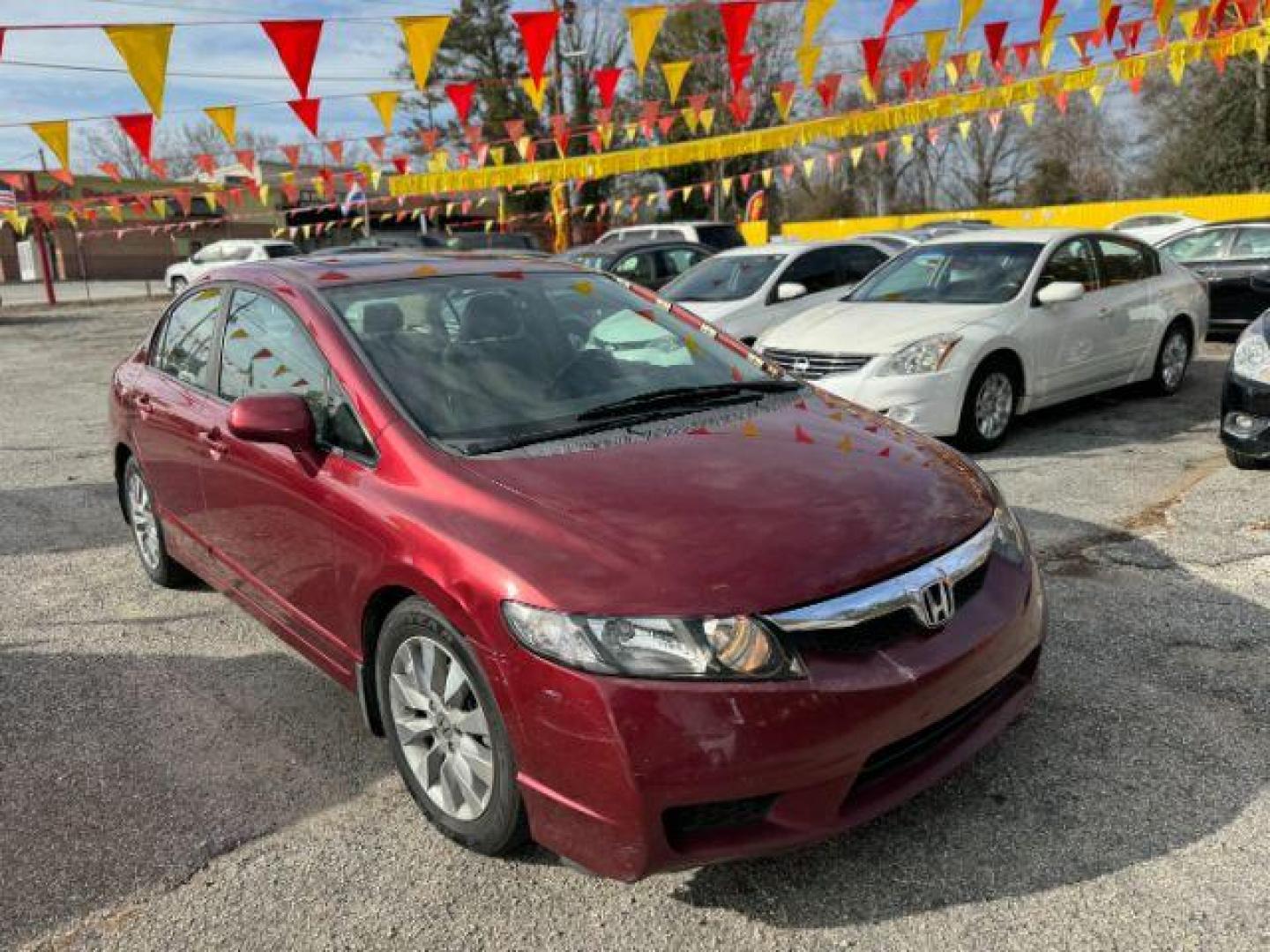 2010 Maroon Honda Civic EX-L Sedan 5-Speed A (19XFA1F92AE) with an 1.8L L4 SOHC 16V engine, 5-Speed Automatic transmission, located at 1806 Veterans Memorial Hwy SW, Austell, GA, 30168, (770) 944-9558, 33.817959, -84.606987 - Photo#2