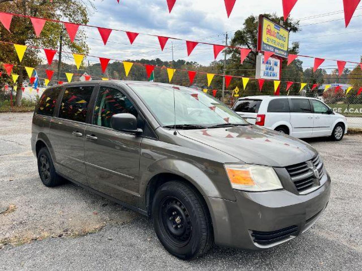 2010 Gray Dodge Grand Caravan SE (2D4RN4DE8AR) with an 3.3L V6 OHV 12V engine, 4-Speed Automatic transmission, located at 1806 Veterans Memorial Hwy SW, Austell, GA, 30168, (770) 944-9558, 33.817959, -84.606987 - Photo#2