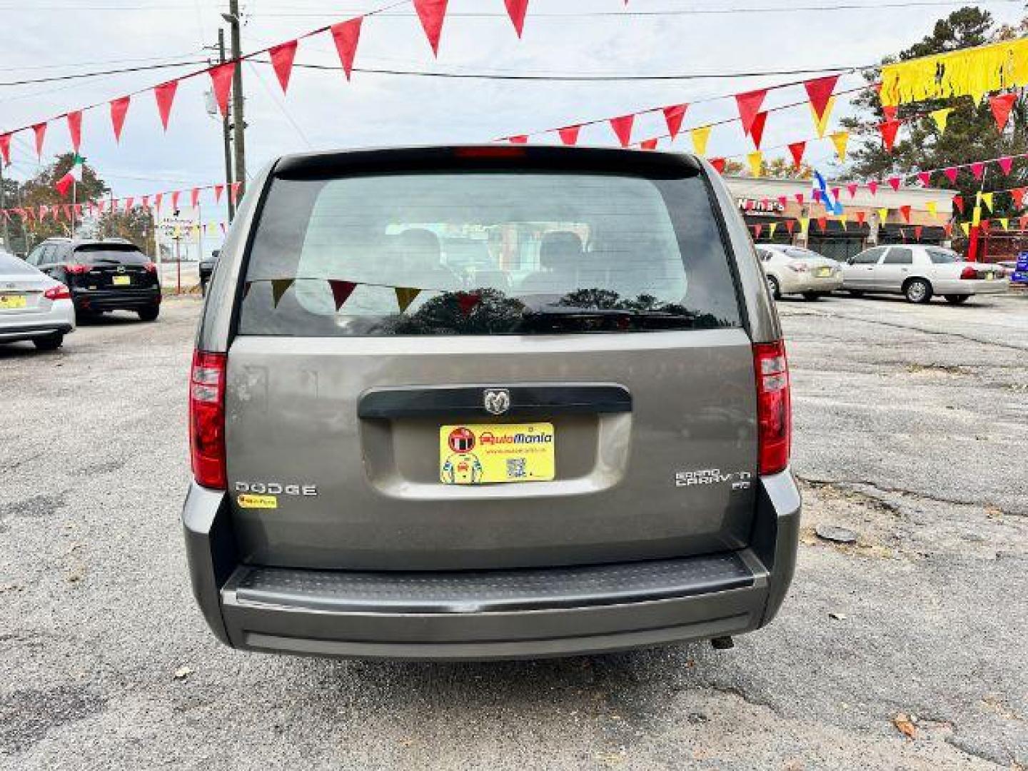 2010 Gray Dodge Grand Caravan SE (2D4RN4DE8AR) with an 3.3L V6 OHV 12V engine, 4-Speed Automatic transmission, located at 1806 Veterans Memorial Hwy SW, Austell, GA, 30168, (770) 944-9558, 33.817959, -84.606987 - Photo#4