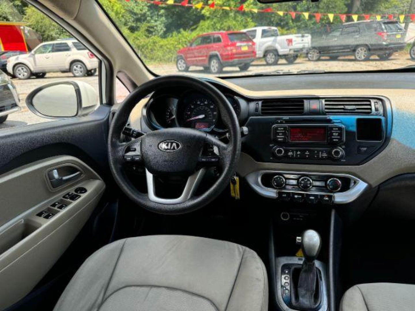 2015 White Kia Rio LX (KNADM4A37F6) with an 1.6L L4 DOHC 16V engine, 4-Speed Automatic transmission, located at 1806 Veterans Memorial Hwy SW, Austell, GA, 30168, (770) 944-9558, 33.817959, -84.606987 - Photo#12