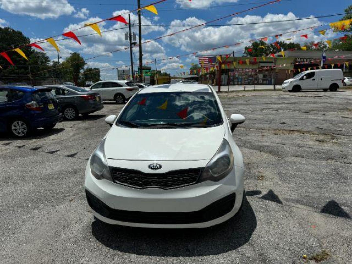 2015 White Kia Rio LX (KNADM4A37F6) with an 1.6L L4 DOHC 16V engine, 4-Speed Automatic transmission, located at 1806 Veterans Memorial Hwy SW, Austell, GA, 30168, (770) 944-9558, 33.817959, -84.606987 - Photo#1