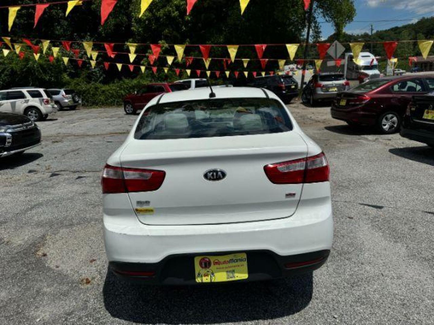 2015 White Kia Rio LX (KNADM4A37F6) with an 1.6L L4 DOHC 16V engine, 4-Speed Automatic transmission, located at 1806 Veterans Memorial Hwy SW, Austell, GA, 30168, (770) 944-9558, 33.817959, -84.606987 - Photo#4