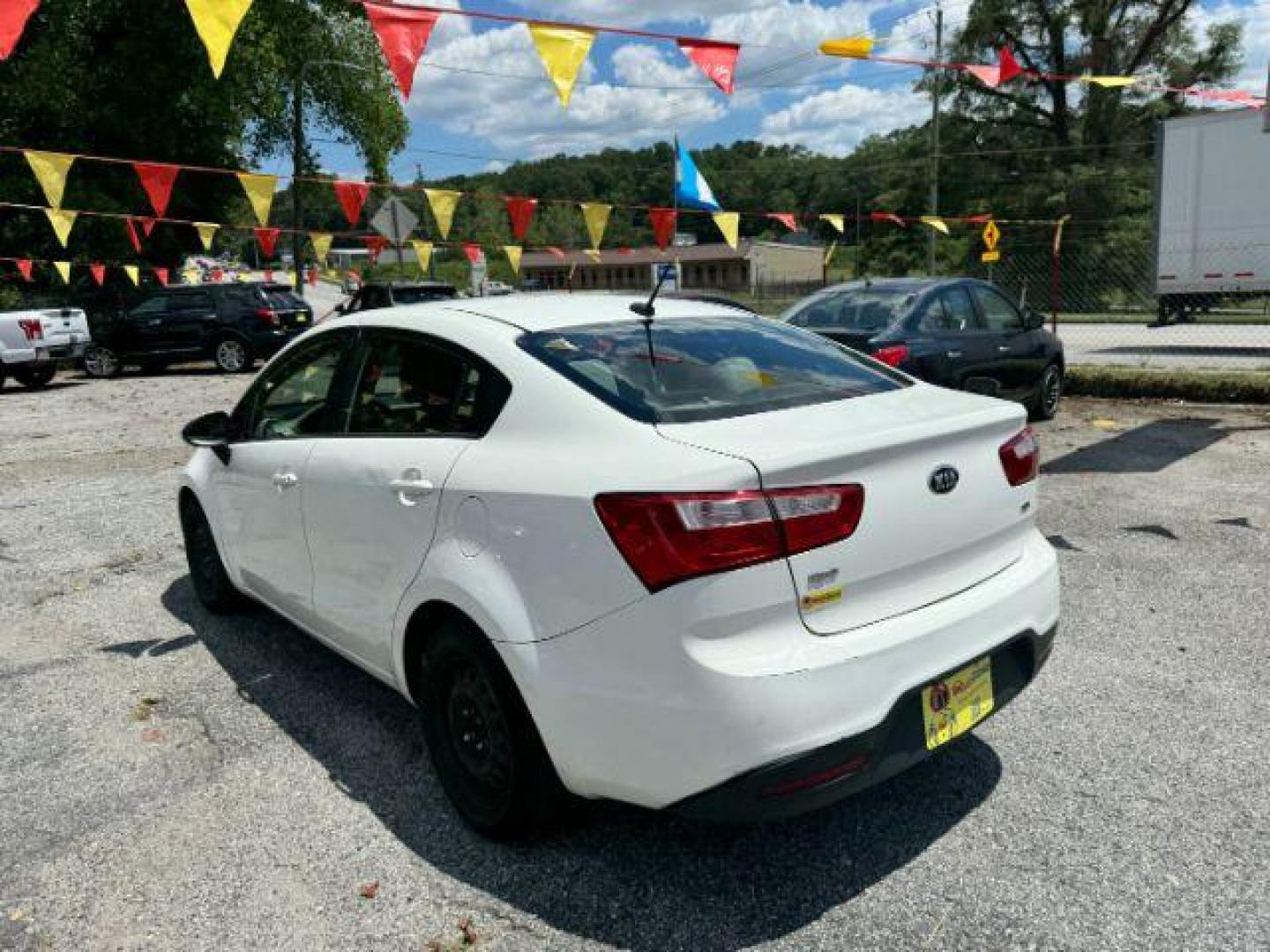 2015 White Kia Rio LX (KNADM4A37F6) with an 1.6L L4 DOHC 16V engine, 4-Speed Automatic transmission, located at 1806 Veterans Memorial Hwy SW, Austell, GA, 30168, (770) 944-9558, 33.817959, -84.606987 - Photo#5