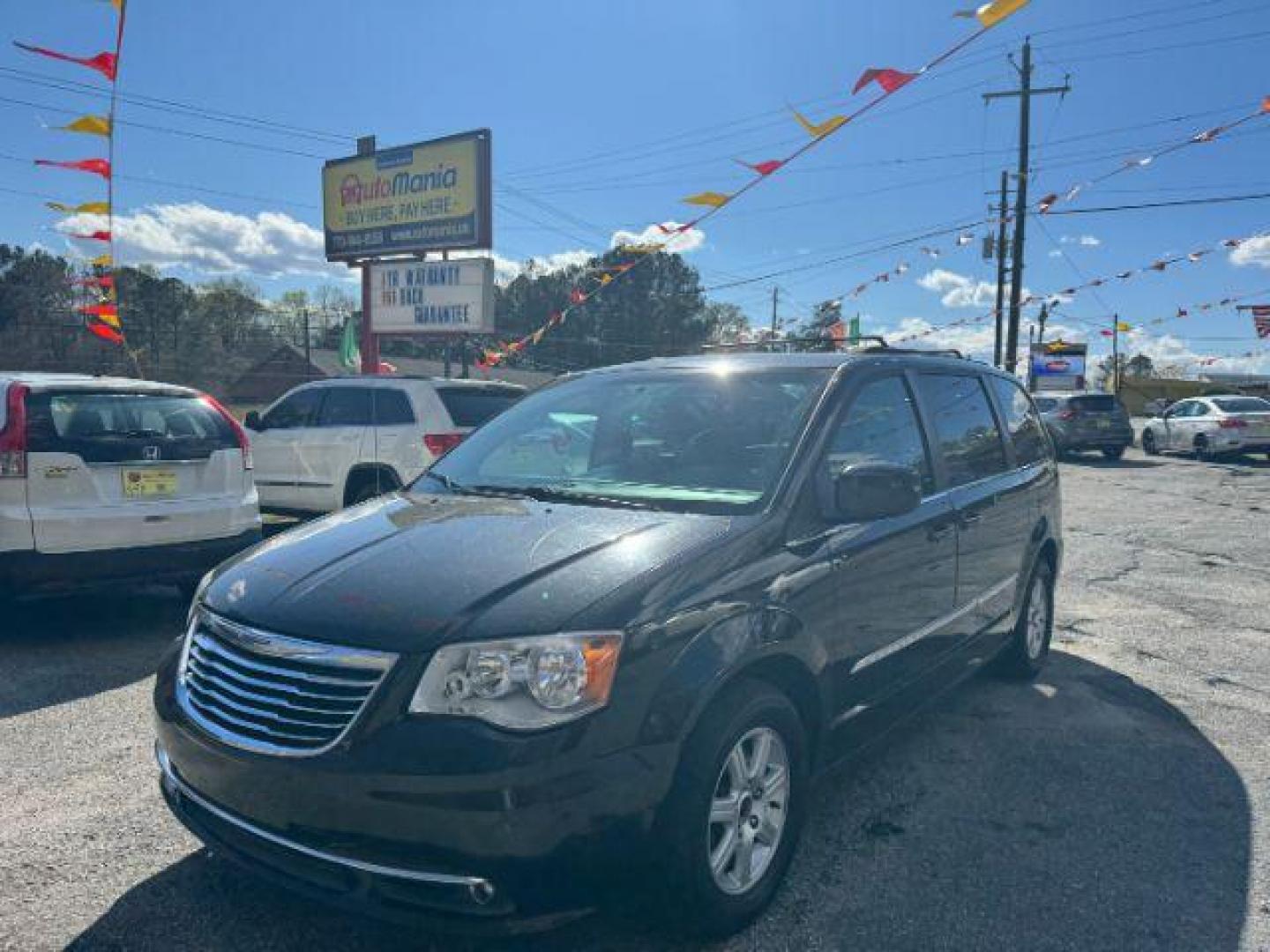 2012 Black Chrysler Town and Country Touring (2C4RC1BG3CR) with an 3.6L V6 DOHC 24V engine, 6-Speed Automatic transmission, located at 1806 Veterans Memorial Hwy SW, Austell, GA, 30168, (770) 944-9558, 33.817959, -84.606987 - Photo#0