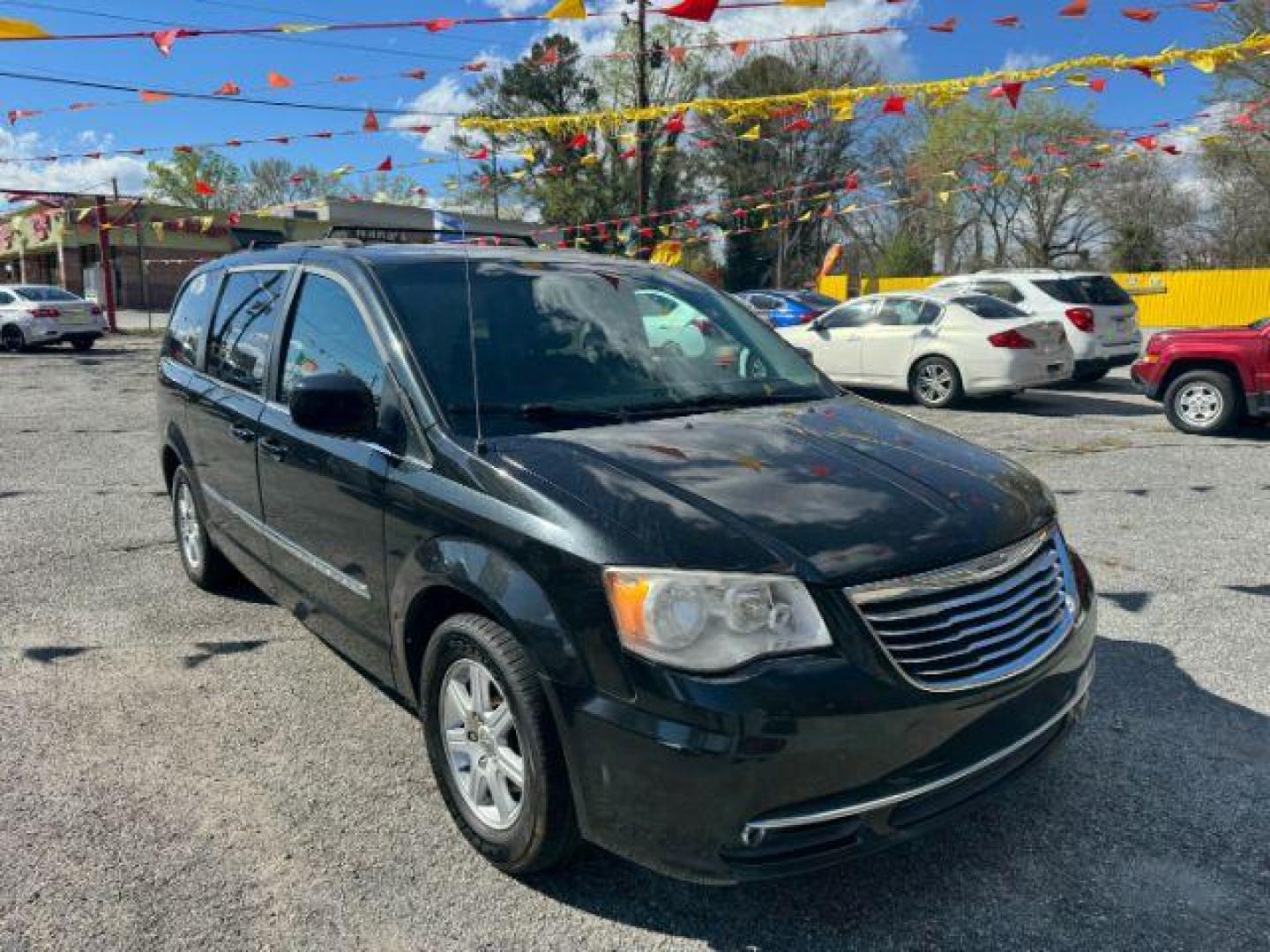 2012 Black Chrysler Town and Country Touring (2C4RC1BG3CR) with an 3.6L V6 DOHC 24V engine, 6-Speed Automatic transmission, located at 1806 Veterans Memorial Hwy SW, Austell, GA, 30168, (770) 944-9558, 33.817959, -84.606987 - Photo#1