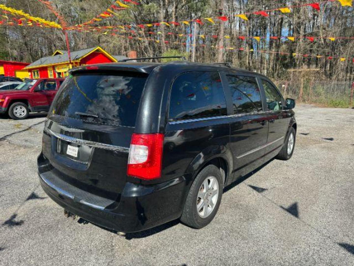 2012 Black Chrysler Town and Country Touring (2C4RC1BG3CR) with an 3.6L V6 DOHC 24V engine, 6-Speed Automatic transmission, located at 1806 Veterans Memorial Hwy SW, Austell, GA, 30168, (770) 944-9558, 33.817959, -84.606987 - Photo#2